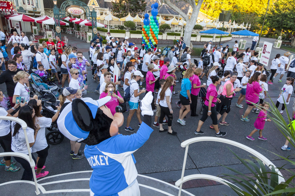 mickey-mouse-waves-at-choc-walk-participants-as-they-walk-down-main-street-u-s-a